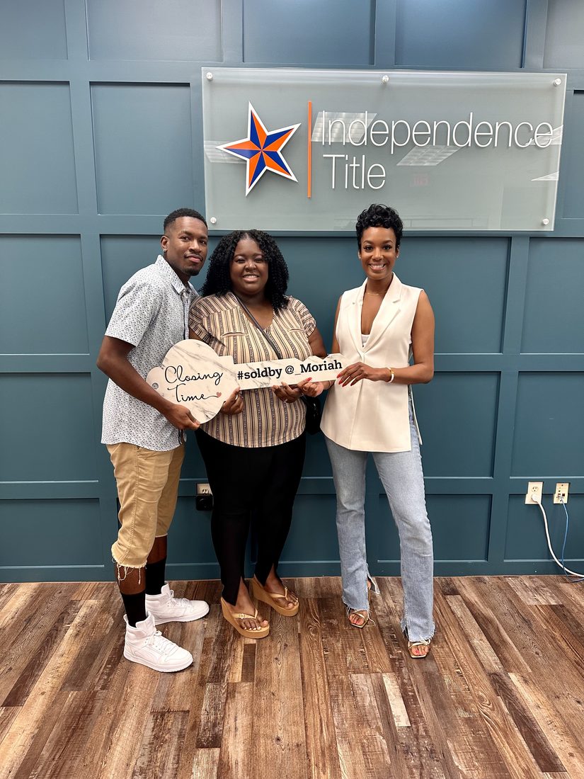 Diversify Real Estate Group clients celebrating a closing at Independence Title